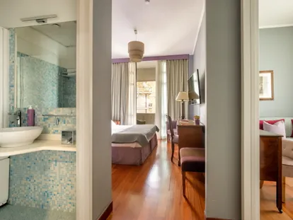 Bathroom with shower and a view into the Executive Double room
